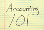 Accouting 101 written on yellow legal pad paper
